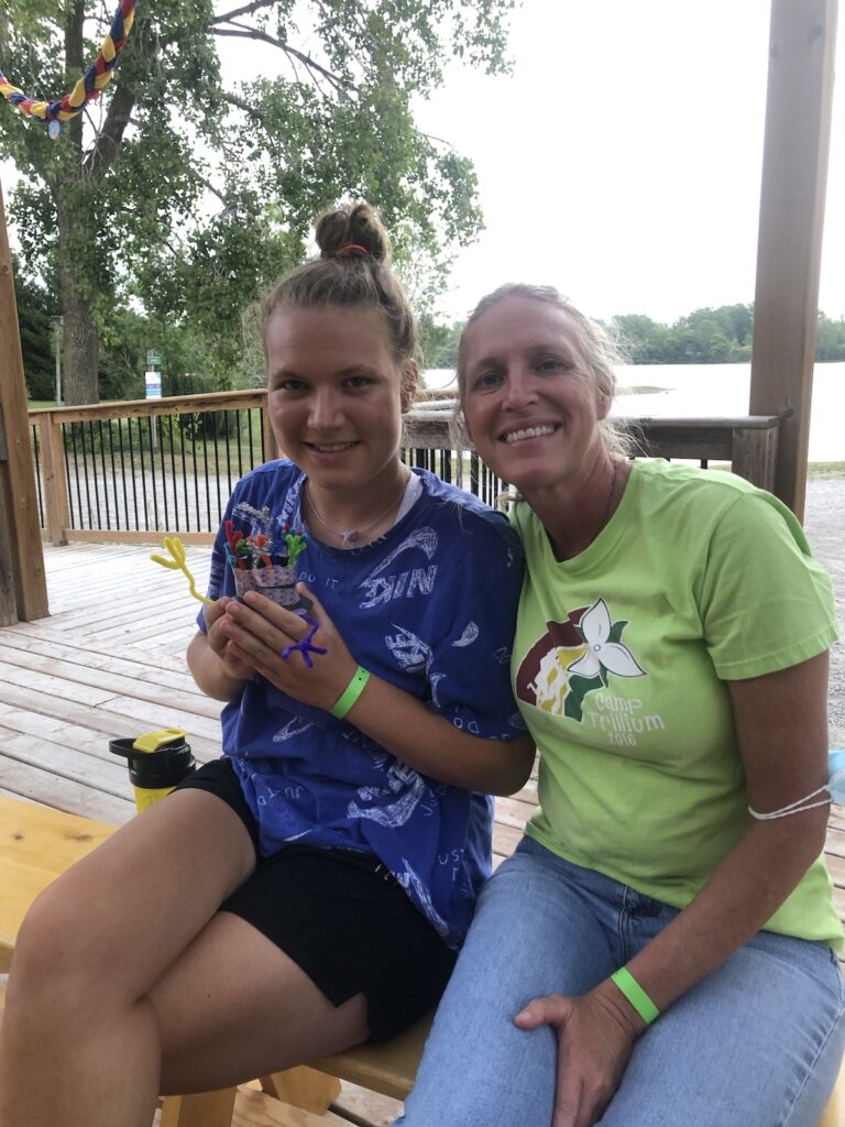 traci and volunteer at camp