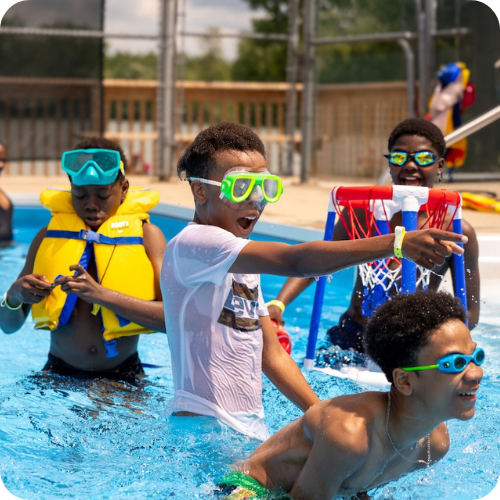 campers enjoying time in the pool at camp with goggles