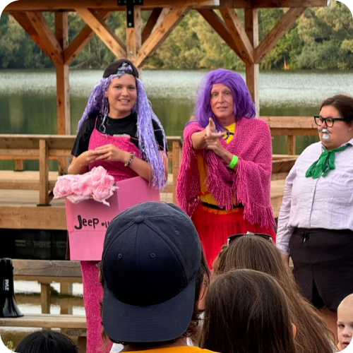 traci and volunteers in costume at camp
