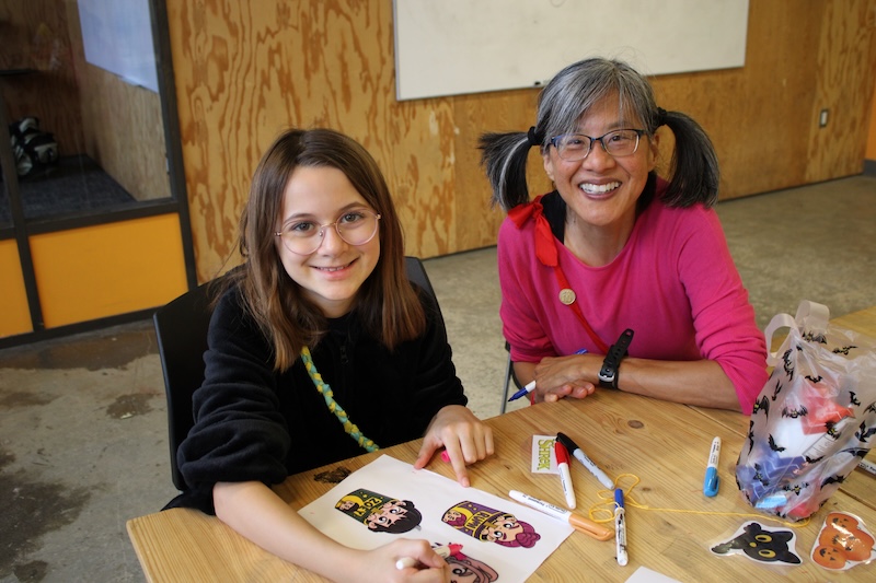 volunteer and camper making art