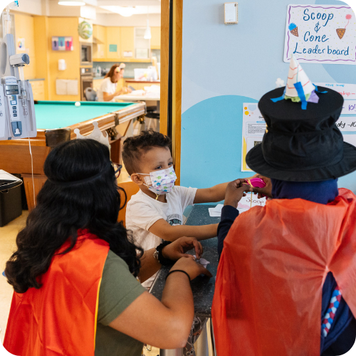 campers and volunteers in costume in the hospital