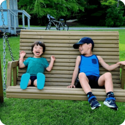 owen laughing on a bench